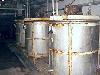 Stainless Steel Mix Tanks, with mixers.
